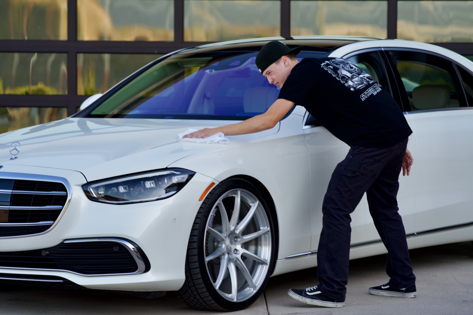 Lincoln carefully detailing a Mercedes-Benz