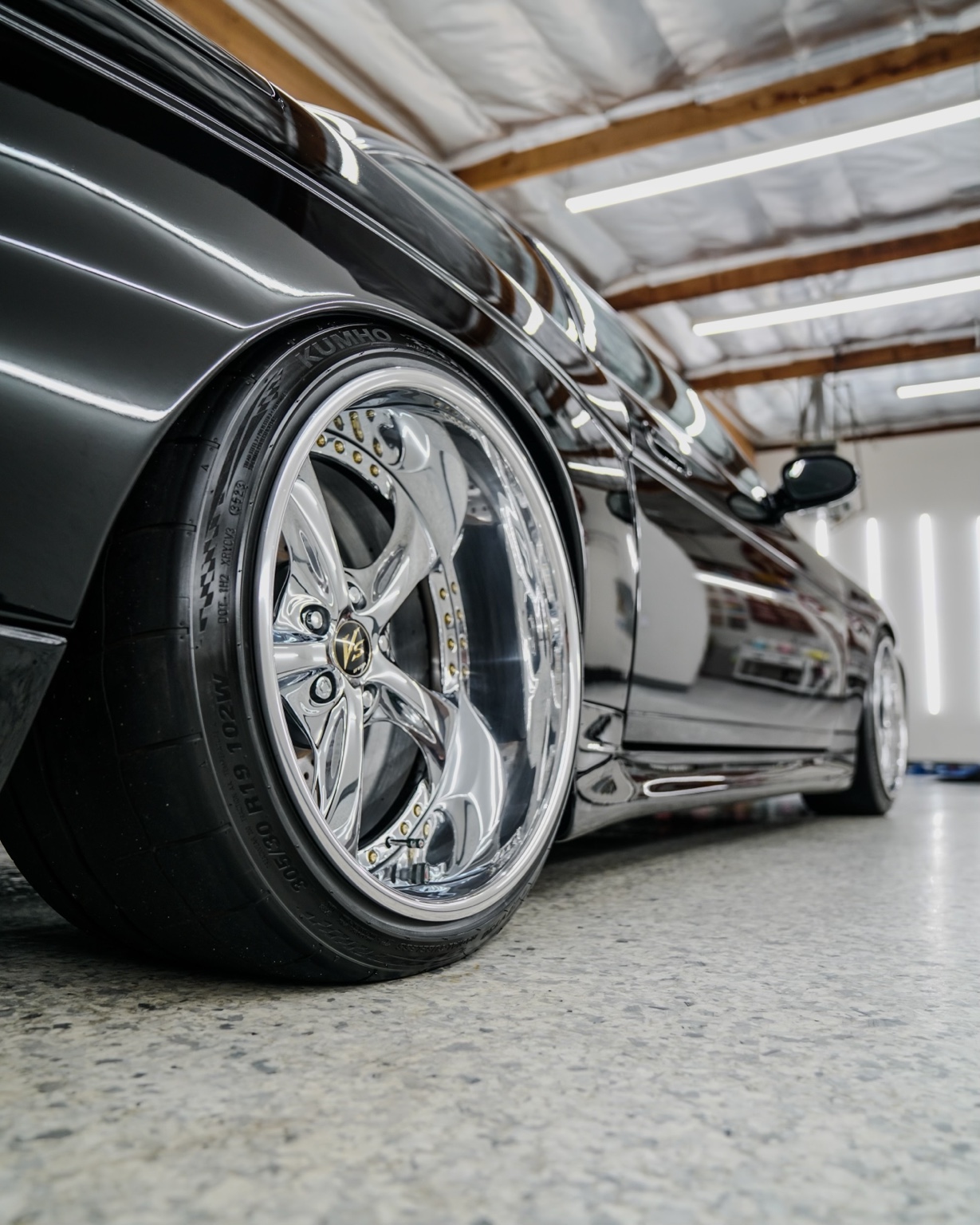 Detailed chrome wheel and glossy black paint